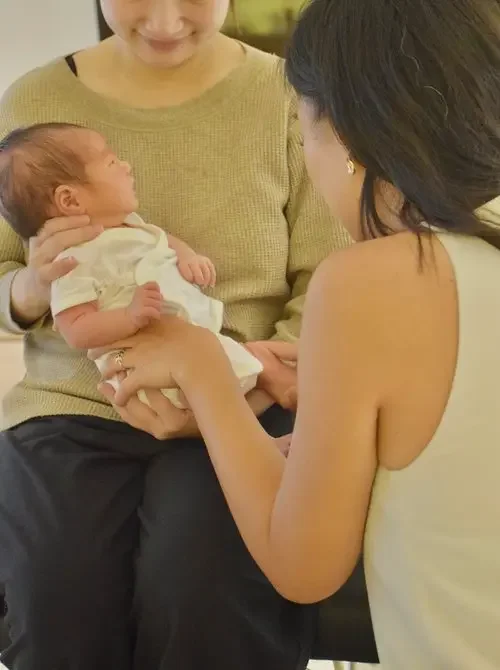 A baby resting — the tenderness at the heart of our care
